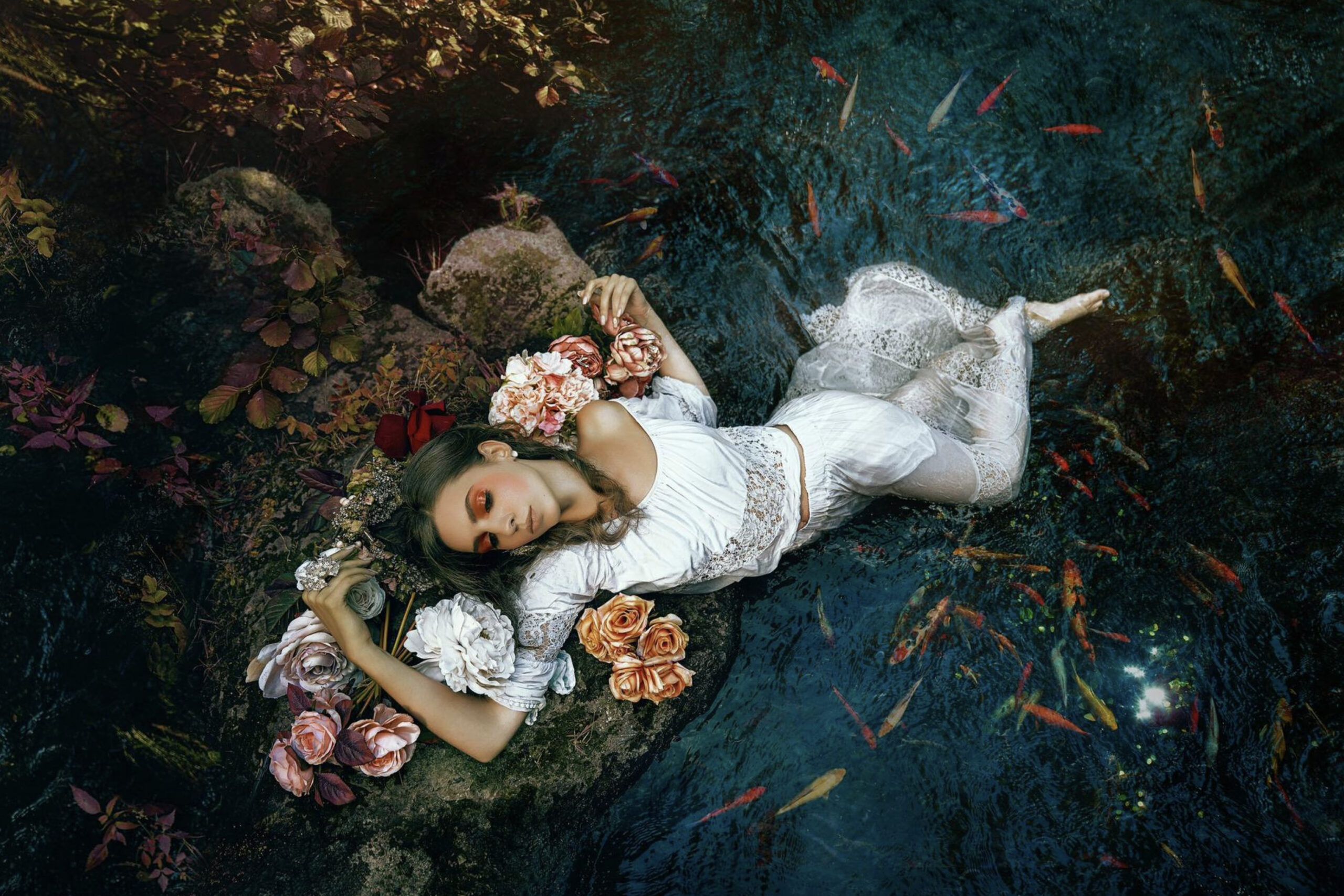 Creative retouching example from Luca Storelli in PhotoWhoa Masterclass – bride with flowers in water, fine art wedding photography style.